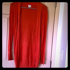 bright orange cardigan